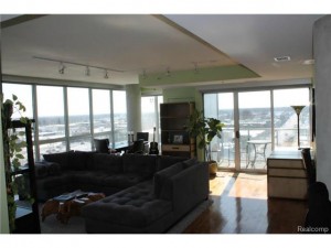 Living area w/walnut flooring throughout